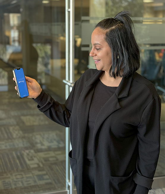 woman holding mobile device